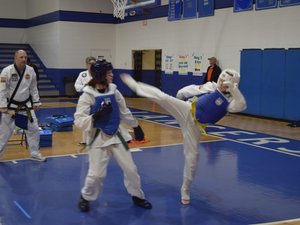 Two students sparring each other